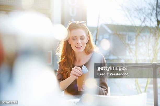 young woman taking notes out of her purse - counting stock pictures, royalty-free photos & images