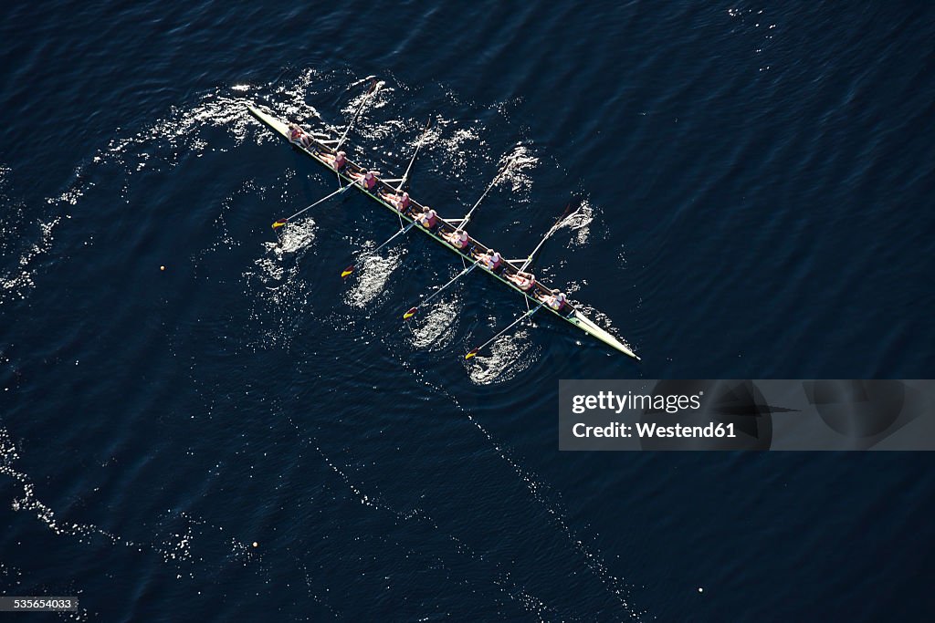 Elevated view of rowing eight in water