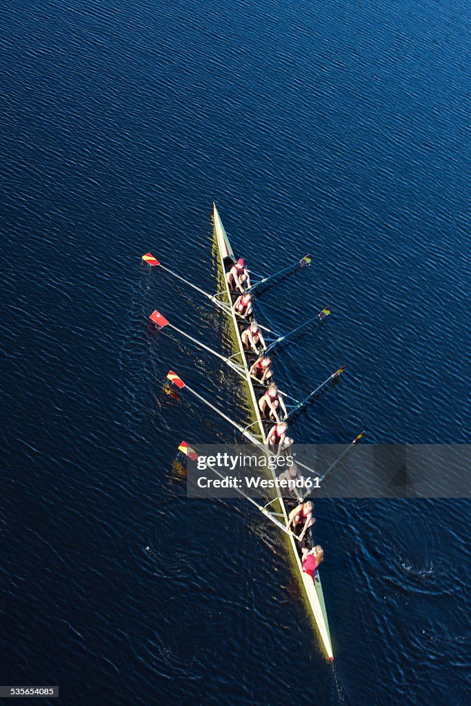 Elevated view of female's rowing eight in water