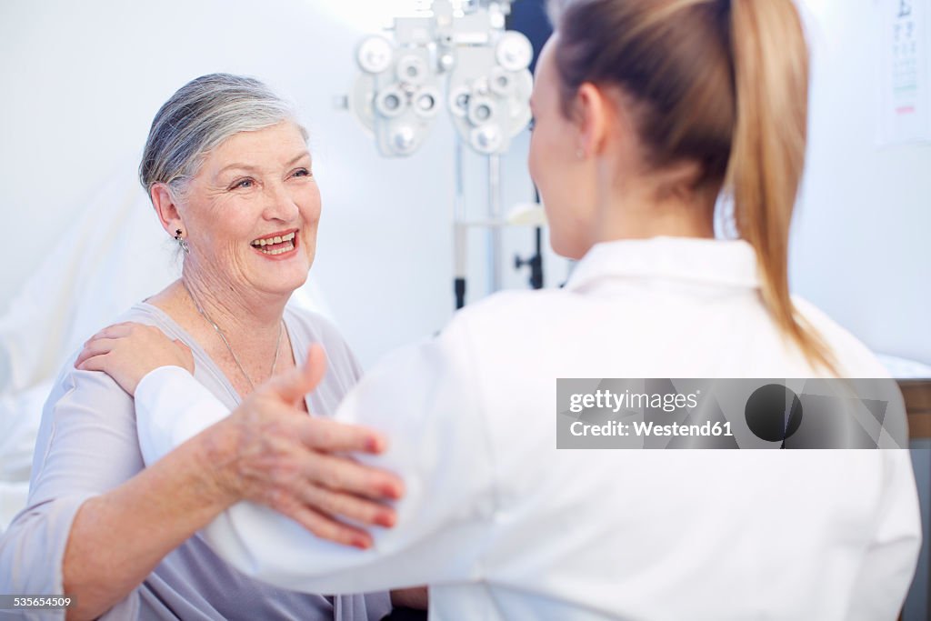 Smiling senior woman at the eye doctor