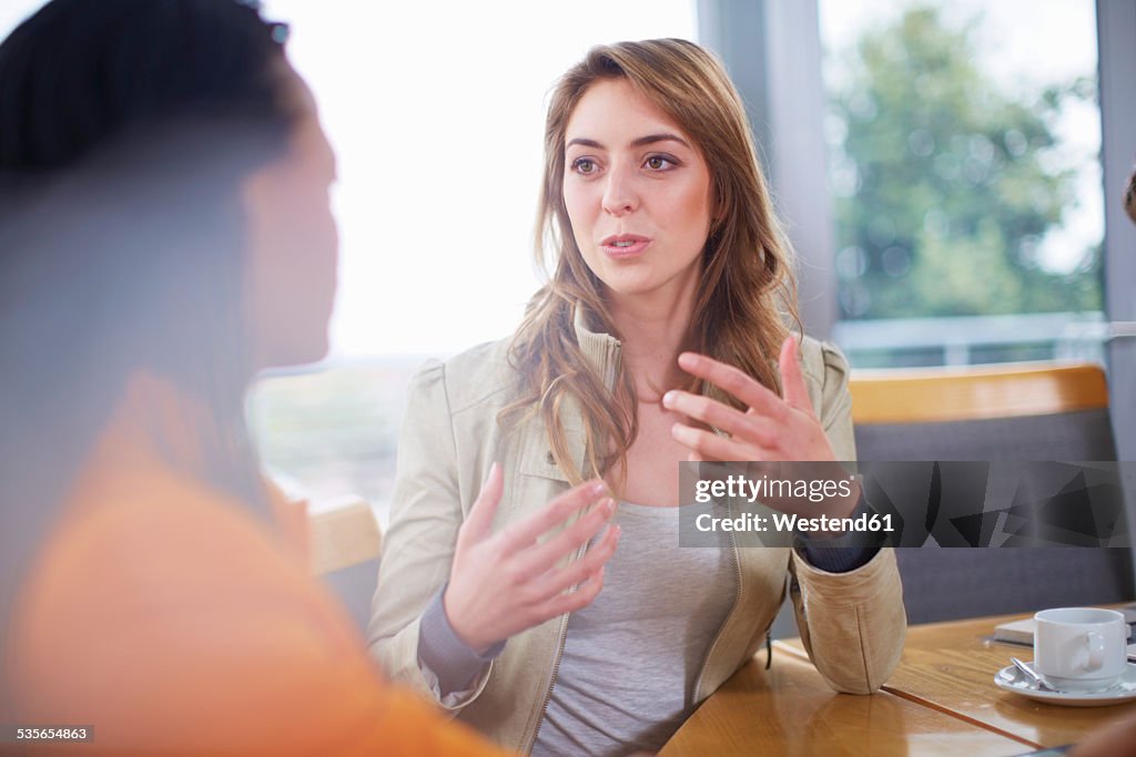 Portrait of businesswoman explaning something