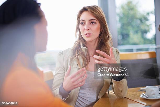 portrait of businesswoman explaning something - speaking explaining young woman stock pictures, royalty-free photos & images