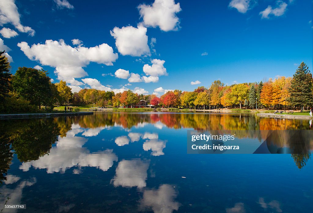 Canada, Quebec, Montreal, Forest reflecting in lake in autumn