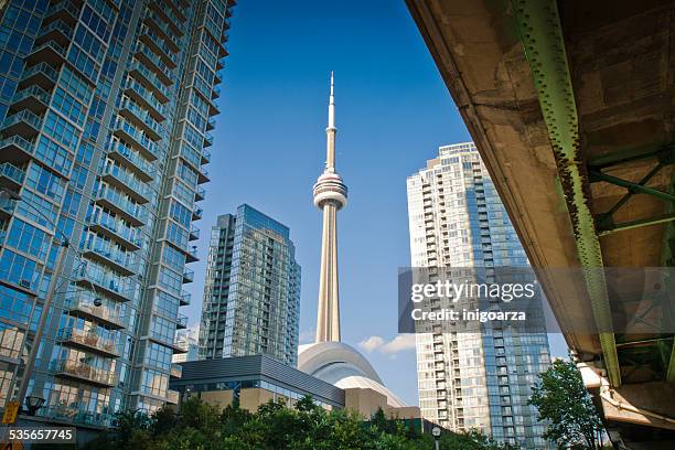 canada, ontario, toronto, low angle view of cn tower and skyscrapers - cn tower stock pictures, royalty-free photos & images