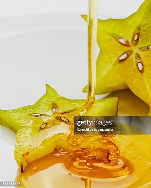 star fruit with honey - starfruit stock pictures, royalty-free photos & images