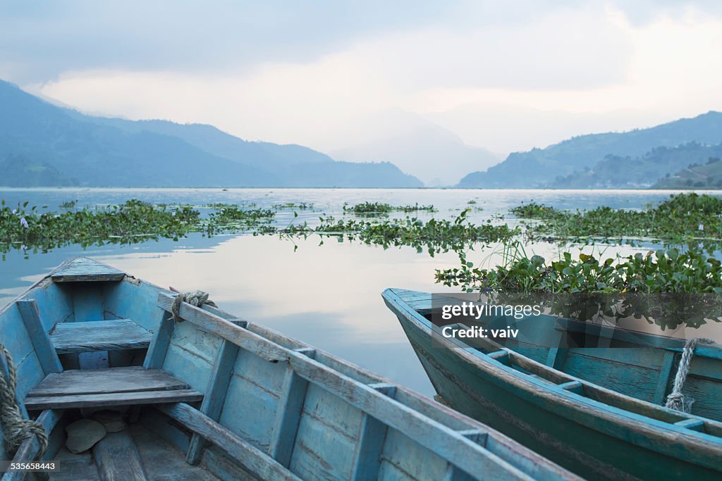 Nepal, Phewa, Cropped shot of two rowboats in mountain lake