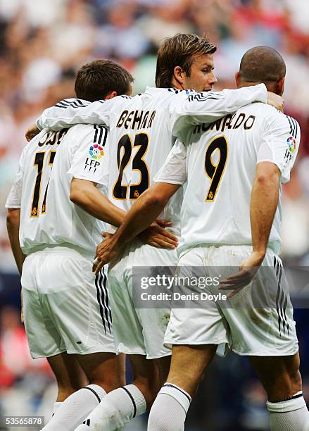 Michael Owen celebrates his goal with Ronaldo and David Beckham during the La Liga match between Real Madrid and Racing de Santander at the Bernabeu...