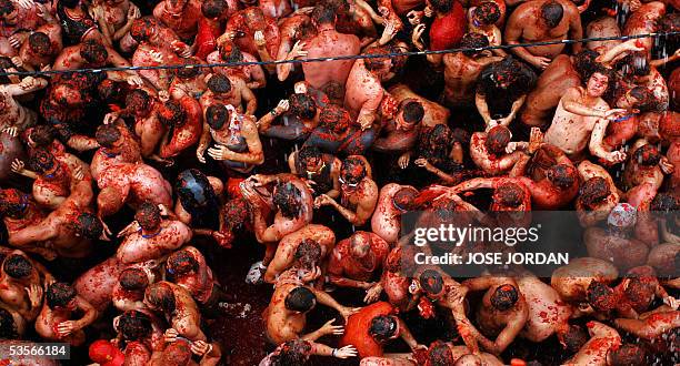 People throw tomatoes during the " Tomatina " Festival taking place the last Wednesday of August in Bunol, near Valencia, southeastern Spain, 31...