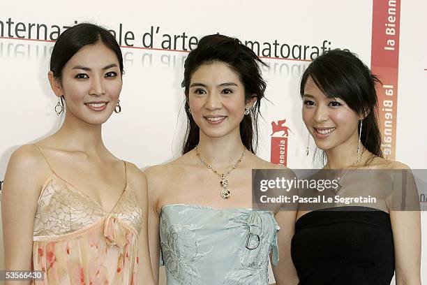 Korean actress So-yeon Kim, Taiwan actress Charlie Yeung and Chinese actress Jingchu Zhang wave at a photocall for out of competition film "Seven...