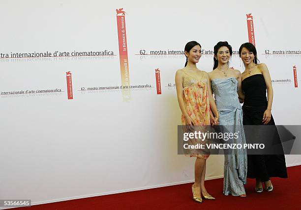 Chinese actress Kim So Yeun poses with her compatriots Charlie Young and Zhang Jingchu duringthe "Seven Swords" photocall in Venice Lido 31 August...