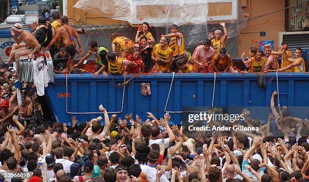 People throw tomatoes from a lorry during the 'Tomatina' on August 31, 2005 in Bunyol, Valencia, Spain. The origins of the Tomatina are unknown,...