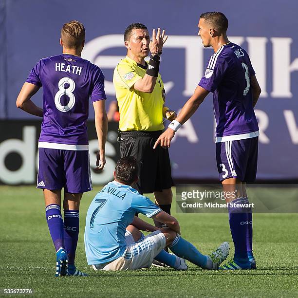 Forward David Villa of New York City FC, midfielder Harrison Heath and defender Seb Hines of Orlando City FC during the match at Yankee Stadium on...