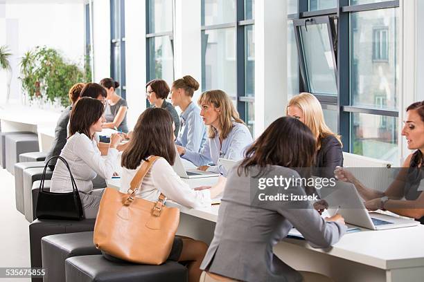 large group of women at job fair - job fair stock pictures, royalty-free photos & images
