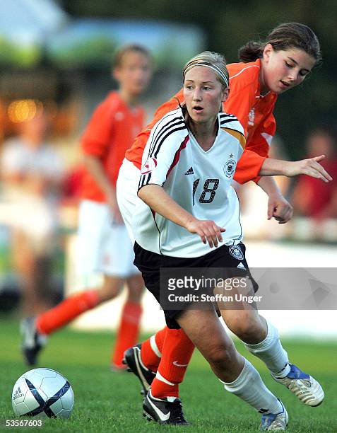 Nora Kirstein of Germany competes with Marloes Hulshof of the Netherlands during the womens under 15 friendly match between Germany and the...