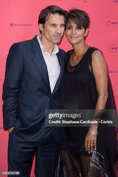 Olivier Martinez and Halle Berry attend the 'Toiles Enchantees' Red Carpet as part of the Champs Elysees Film Festival 2013 at Publicis Champs...