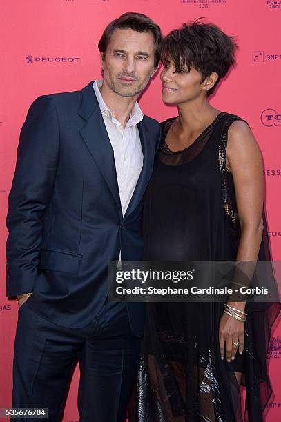 Olivier Martinez and Halle Berry attend the 'Toiles Enchantees' Red Carpet as part of the Champs Elysees Film Festival 2013 at Publicis Champs...