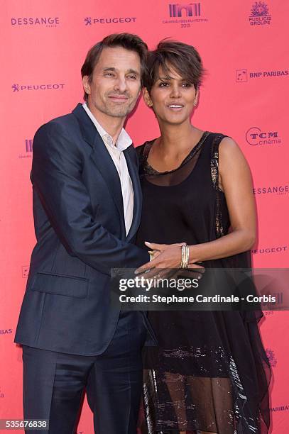 Olivier Martinez and Halle Berry attend the 'Toiles Enchantees' Red Carpet as part of the Champs Elysees Film Festival 2013 at Publicis Champs...