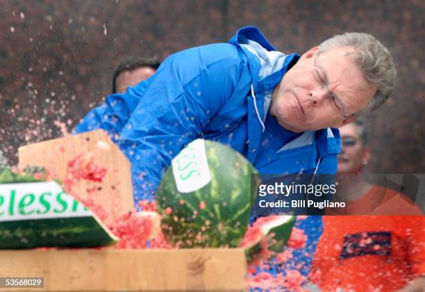 Chrysler Group incoming President and CEO Tom Lasorda smashes a watermelon repesenting homelessness with a giant wood mallet during a United Way...