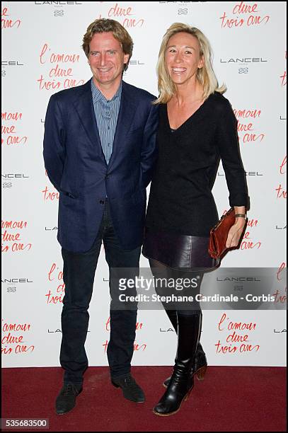 Charles Beigbeder and his wife Carine attend the premiere of "L'Amour Dure Trois Ans" at Le Grand Rex, in Paris.