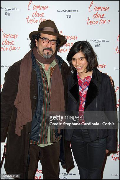 Atiq Rahimi and his daughter Alice attend the premiere of "L'Amour Dure Trois Ans" at Le Grand Rex, in Paris.