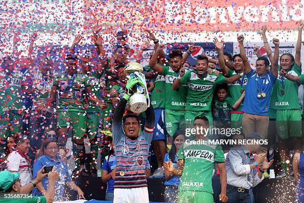 Dragon players celebrate with the trophy after winning the 2016 El Salvador Clausura tournament final football match against CD Águila in Cuscatlan...