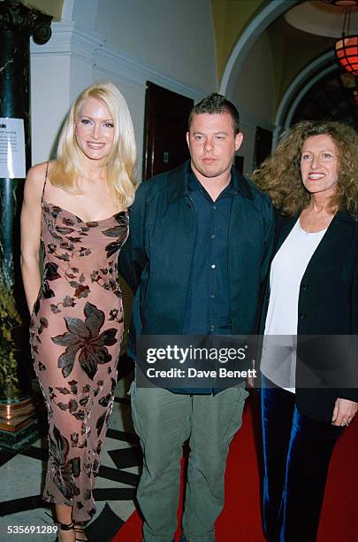 American model Caprice Bourret, with fashion designers Alexander McQueen and Nicole Farhi, at the Smirnoff International Fashion Awards, held at...