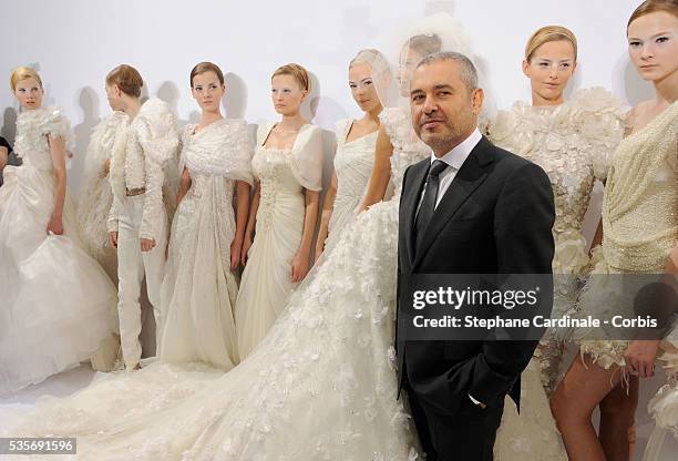 Designer Elie Saab poses with his Models during the "Elie Saab" Haute Couture A/W 2009/2010 fashion show in Paris.