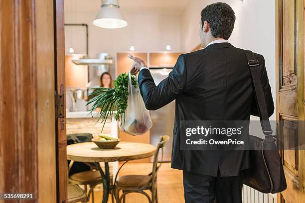 young business man brining in the shopping - young man groceries kitchen stock pictures, royalty-free photos & images