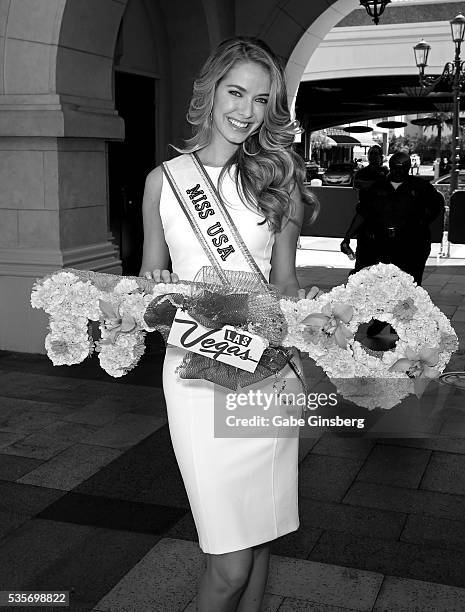 Miss USA 2015 Olivia Jordan holds a ceremonial key during a launch event for the Las Vegas official Snapchat channel at The Venetian Las Vegas on May...