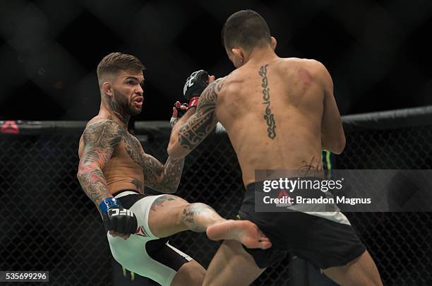 Cody Garbrandt kicks Thomas Almeida in their bantamweight bout during the UFC Fight Night event inside the Mandalay Bay Events Center on May 29, 2016...