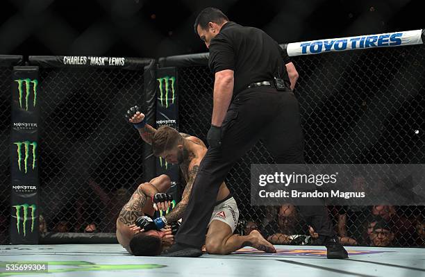 Cody Garbrandt punches Thomas Almeida in their bantamweight bout during the UFC Fight Night event inside the Mandalay Bay Events Center on May 29,...