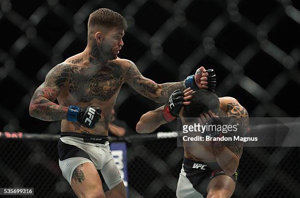 Cody Garbrandt punches Thomas Almeida in their bantamweight bout during the UFC Fight Night event inside the Mandalay Bay Events Center on May 29,...