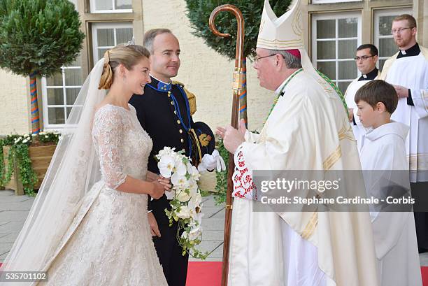 Princess Stephanie of Luxembourg and her brother Count Jehan de Lannoy greet Most Reverend Jean-Claude Hollerich, Archbishop of Luxembourg as they...