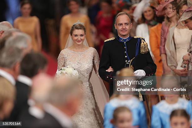 Princess Stephanie of Luxembourg walks down the aisle with her brother Count Jehan de Lannoy during the wedding ceremony of Prince Guillaume of...