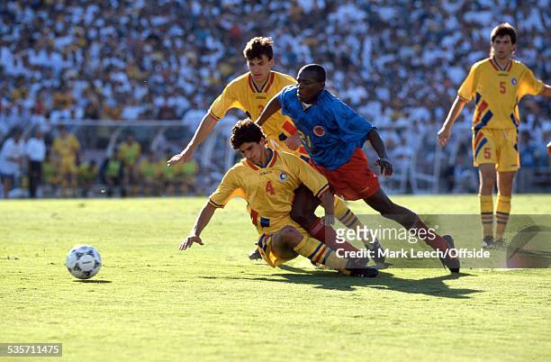 June 1994, Fifa World Cup, Colombia v Romania, Miodrag Belodedici of Romania tackles Faustino Asprilla of Colombia.