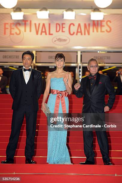Actor Takashi Miike, actress Nanako Matsushima and director Takao Osawa attend the 'Wara No Tate' premiere during the 66th Cannes International Film...