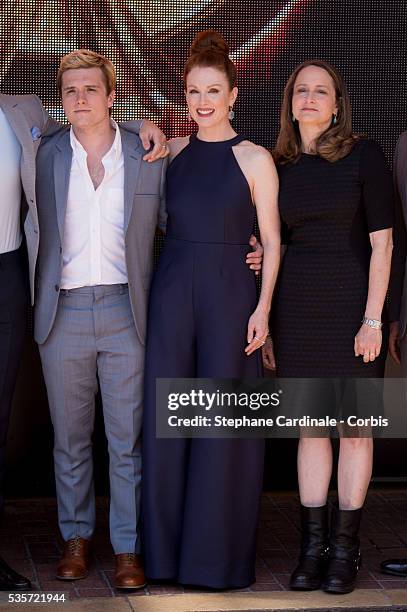 Josh Hutcherson, Julianne Moore and Nina Jacobson attends 'The Hunger Games: Mockingjay Part 1' photocall during the 67th Cannes Film Festival