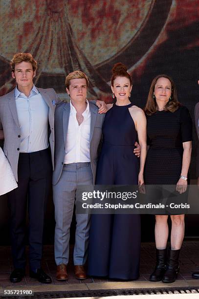 Sam Claflin, Josh Hutcherson, Julianne Moore and Nina Jacobson attends 'The Hunger Games: Mockingjay Part 1' photocall during the 67th Cannes Film...