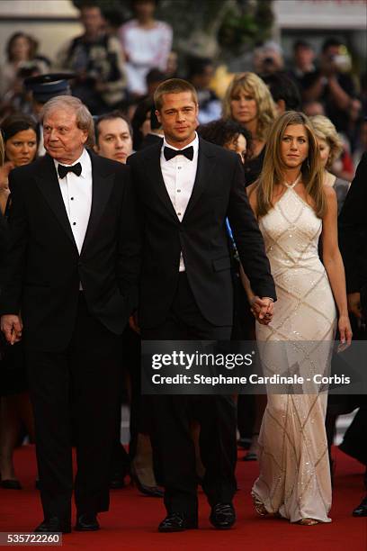 Director Wolfgang Petersen with actors Brad Pitt and Jennifer Aniston attend the premiere of Petersen's movie "Troy", at the 57th Cannes film...