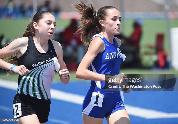 Maria Coffin of Annapolis makes her move for the lead against Abigail Green of Walter Johnson for the win in the 4A 1600 meter final during the...