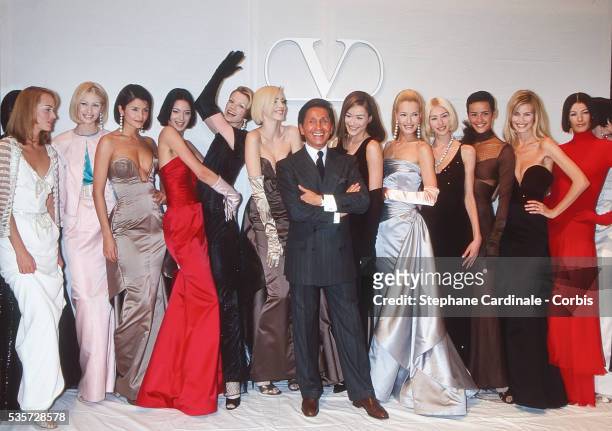 Fashion designer Valentino pose with models Helena Christensen, Kristen McMenamy, Nadja Auermann, Carla Bruni, Karen Mulder and Claudia Schiffer...