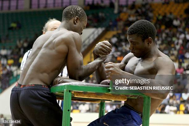 Arm wrestlers compete at the International Arm Wrestling Championship in Bamako on May 29, 2016. The first edition of the International Arm Wrestling...