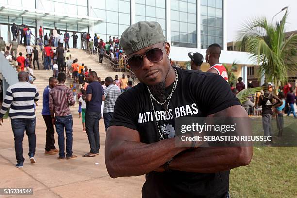 Contestant poses at the International Arm Wrestling Championship in Bamako on May 29, 2016. The first edition of the International Arm Wrestling...