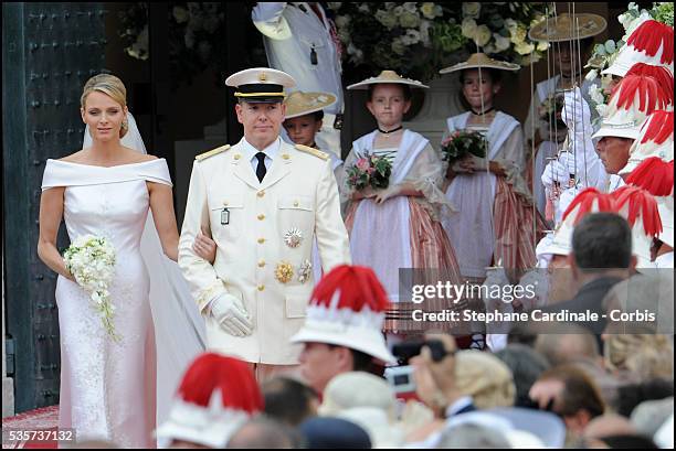 Princess Charlene of Monaco and Prince Albert II of Monaco leave the religious ceremony of the Wedding at the Prince's Palace, in Monaco.