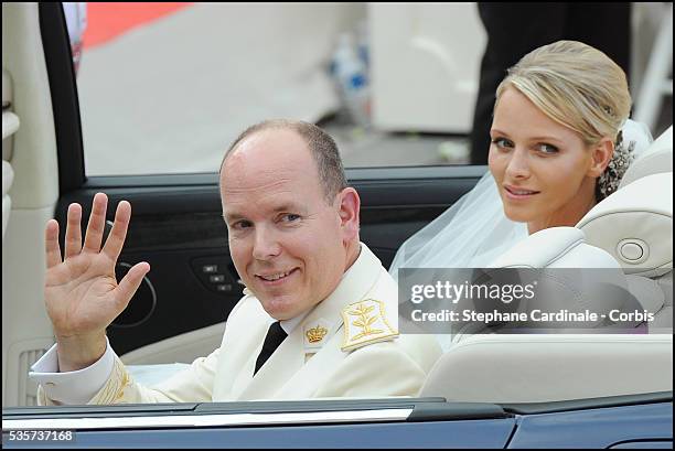 Princess Charlene of Monaco and Prince Albert II of Monaco leave the religious ceremony of the Wedding at the Prince's Palace, in Monaco.