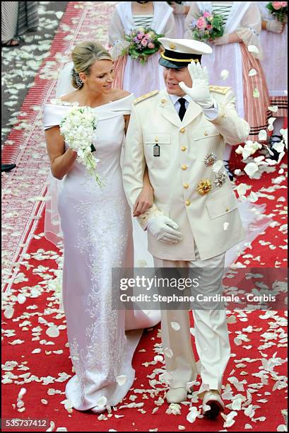 Princess Charlene of Monaco and Prince Albert II of Monaco leave the religious ceremony of the Wedding at the Prince's Palace, in Monaco.