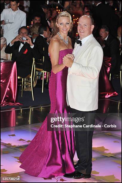 Princess Charlene of Monaco and Prince Albert II of Monaco dance during the 63rd Red Cross Ball at the Sporting Monte-Carlo, in Monaco.