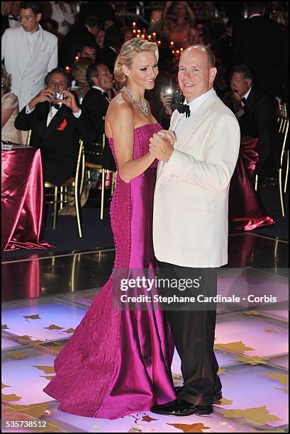 Princess Charlene of Monaco and Prince Albert II of Monaco dance during the 63rd Red Cross Ball at the Sporting Monte-Carlo, in Monaco.