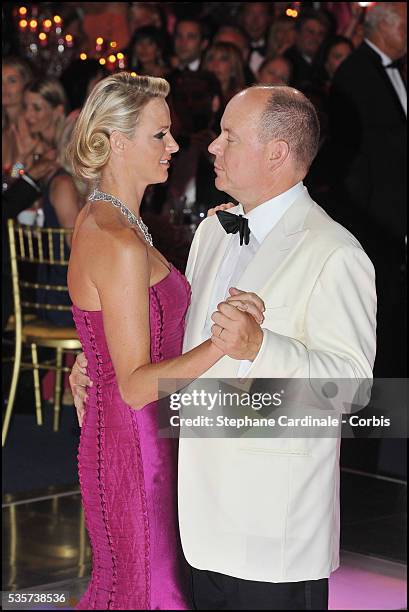 Princess Charlene of Monaco and Prince Albert II of Monaco dance during the 63rd Red Cross Ball at the Sporting Monte-Carlo, in Monaco.