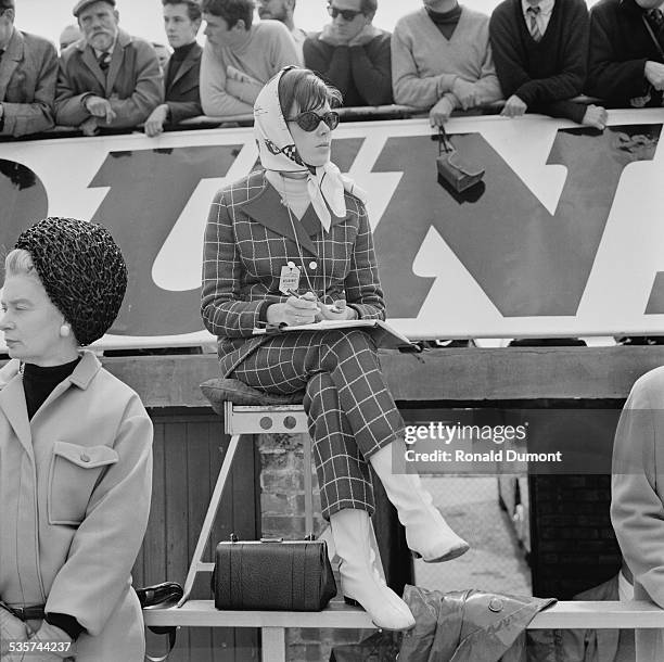 Wife of Jackie Stewart, Helen Stewart watching the action at the Silverstone Circuit, 28th April 1967.